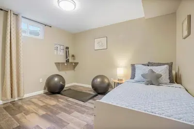 a bedroom with a bed with a teddy bear on it at Sweet Arvada Escape - Near Olde Town in Arvada