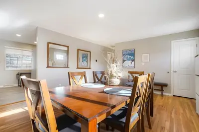 a dining room with a wooden table and chairs at Sweet Arvada Escape - Near Olde Town in Arvada