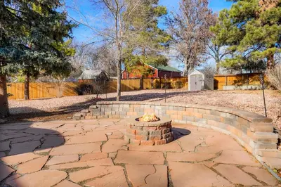 a fire pit in a yard with a fence at Sweet Arvada Escape - Near Olde Town in Arvada