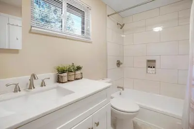 a white bathroom with a sink and a toilet at Sweet Arvada Escape - Near Olde Town in Arvada