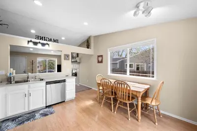 a kitchen with a table and chairs and a window at Wagon Trail in Littleton