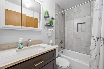 a bathroom with a sink and a toilet and a shower at Wagon Trail in Littleton