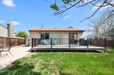 a house with a porch with a fence at Wagon Trail in Littleton