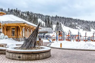 a ski resort with a building in the snow at Frosty Peak Perch in Fraser