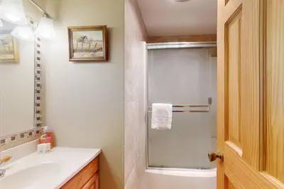 a bathroom with a sink and a glass shower at Frosty Peak Perch in Fraser