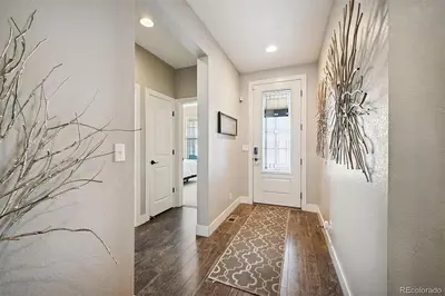 a hallway of a home with a white door at 4BR Home close to Airport in Aurora