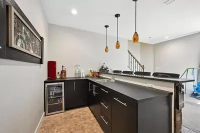 a kitchen with a counter and a sink in it at 4BR Home close to Airport in Aurora