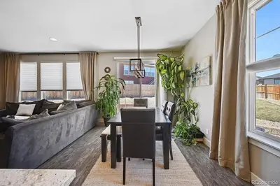 a living room with a couch and a table at 4BR Home close to Airport in Aurora