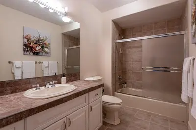 a bathroom with a sink and a toilet and a shower at Luxurious 4BR Retreat - Pool Table & Chic Amenities in Boulder