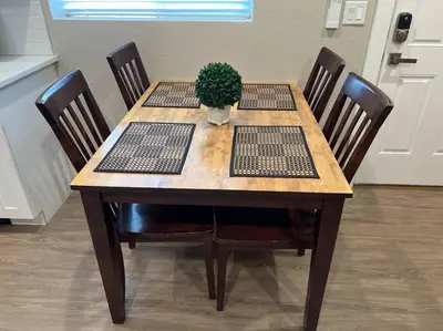 a wooden table with a potted plant on top of it at Stylish and cozy 2 bed in Brighton