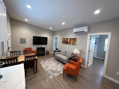 a living room with a couch and a table at Stylish and cozy 2 bed in Brighton