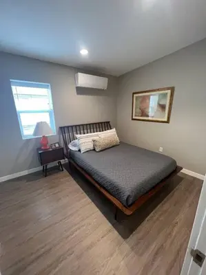 a bedroom with a bed and a window at Stylish and cozy 2 bed in Brighton