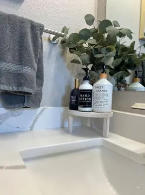 a bathroom with two bottles ofodorizers on a sink at Elegant & cozy 2 bed in Brighton