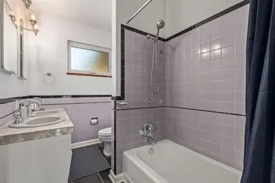 a bathroom with a tub and a sink and a toilet at NEW! 1958 Chic Mid-Mod House in Littleton