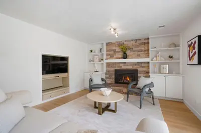 a living room with a couch and a fireplace at Large Home, 2 Living Rooms, Great for Family/Pets! in Arvada
