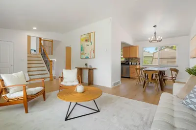 a living room with a couch and a table at Large Home, 2 Living Rooms, Great for Family/Pets! in Arvada