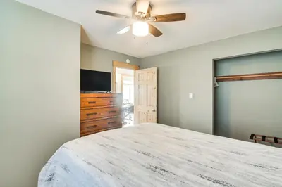 a bedroom with a bed and a ceiling fan at Tabernash Home about 13 Miles to Winter Park! in Tabernash