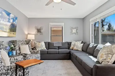 a living room with a couch and chairs at Spirit of the Rockies - Private Backyard & Hot Tub in Fort Collins