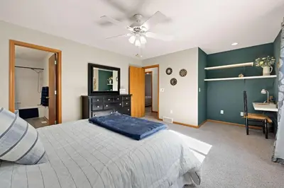 a bedroom with a bed and a ceiling fan at Colorado Mountain Retreat - Easy access to RMNP! in Loveland