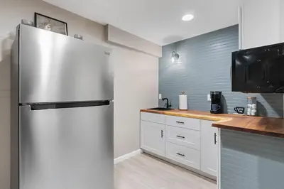 a kitchen with a stainless steel refrigerator at Colorado Mountain Retreat - Easy access to RMNP! in Loveland