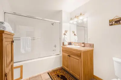 a bathroom with a shower and a sink at Bugle Pointe B06 by Estes Park Condos in Estes Park