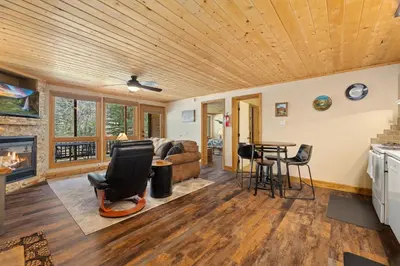 a living room with a wooden ceiling at Creekside Suites 06 by Estes Park Condos in Estes Park