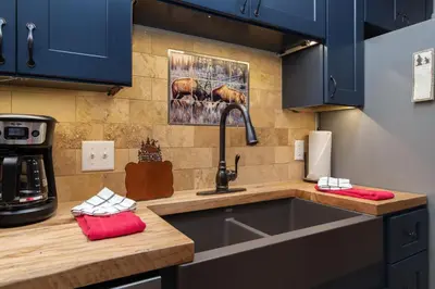 a kitchen with a sink and a counter top at Creekside Suites 12 by Estes Park Condos in Estes Park