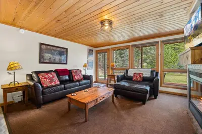 a living room with a couch and a coffee table at Creekside Suites 17 by Estes Park Condos in Estes Park