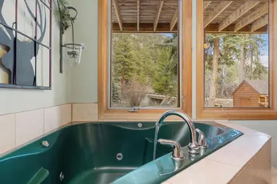 a green sink in a kitchen with a window at Creekside Suites 22 by Estes Park Condos in Estes Park