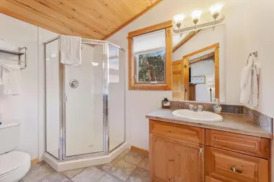 a bathroom with a shower and a sink at Bugle Pointe A08 by Estes Park Condos in Estes Park