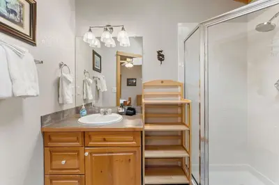 a bathroom with a sink and a shower at Bugle Pointe A12 by Estes Park Condos in Estes Park