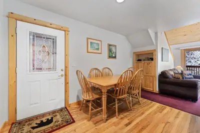 a dining room with a table and chairs at Bugle Pointe A15 by Estes Park Condos in Estes Park