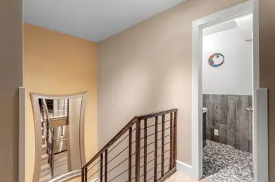 a staircase in a house with a door leading into a room at Frisco 8 Townhomes #4 by Great Western Lodging in Frisco