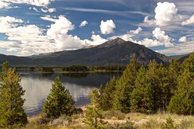 a view of a lake with a mountain in the background at Frisco 8 Townhomes #4 by Great Western Lodging in Frisco