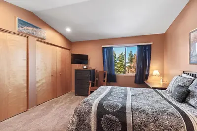 a bedroom with a bed and a window at Lagoon 723D by Great Western Lodging in Frisco