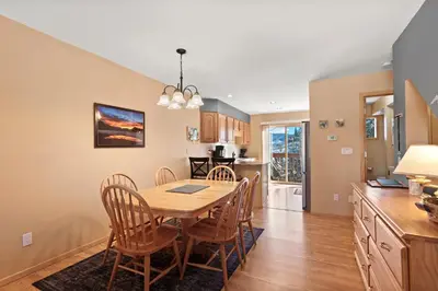 a kitchen and dining room with a table and chairs at Lagoon 723D by Great Western Lodging in Frisco