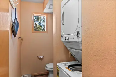 a bathroom with a sink and a toilet and a mirror at Lagoon 723D by Great Western Lodging in Frisco