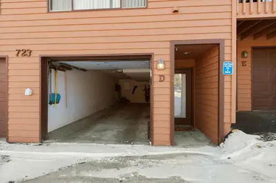 a building with two entrances to a garage at Lagoon 723D by Great Western Lodging in Frisco