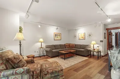 a living room with two couches and a table at Lake Cliffe A101 by Great Western Lodging in Dillon