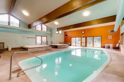 a large swimming pool in a large room with at Lake Cliffe A101 by Great Western Lodging in Dillon