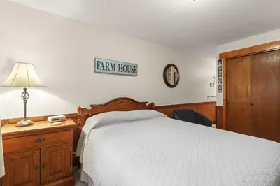 a bedroom with a bed and a sign on the wall at Lake Cliffe A101 by Great Western Lodging in Dillon