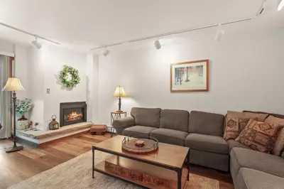 a living room with a couch and a fireplace at Lake Cliffe A101 by Great Western Lodging in Dillon