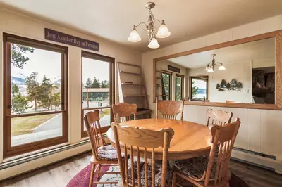 a dining room with a wooden table and chairs at Lake Cliffe E201 by Great Western Lodging in Dillon