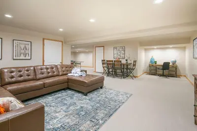a living room with a brown couch and a rug at Parkview Retreat in Windsor