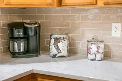 three glass jars sitting on a counter in a kitchen at Parkview Retreat in Windsor