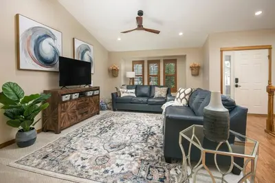 a living room with a couch and a tv at Parkview Retreat in Windsor