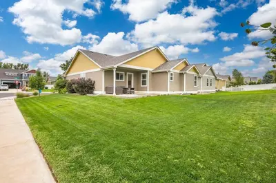 a house with a large yard with green grass at Parkview Retreat in Windsor