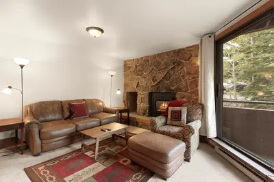 a living room with a couch and a fireplace at Marina Place 115 by Great Western Lodging in Dillon