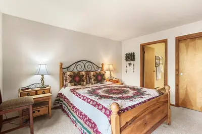a bedroom with a large bed and two night stands at Marina Place 115 by Great Western Lodging in Dillon