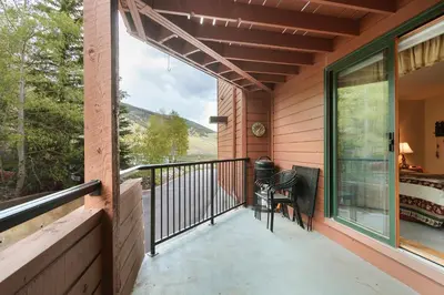 a balcony with a view of the mountains at Marina Place 115 by Great Western Lodging in Dillon